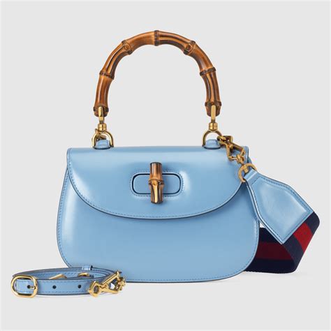 borsa da viaggio in pelle signature blu gucci|Borsa Gucci Bamboo 1947 misura piccola in pelle blu .